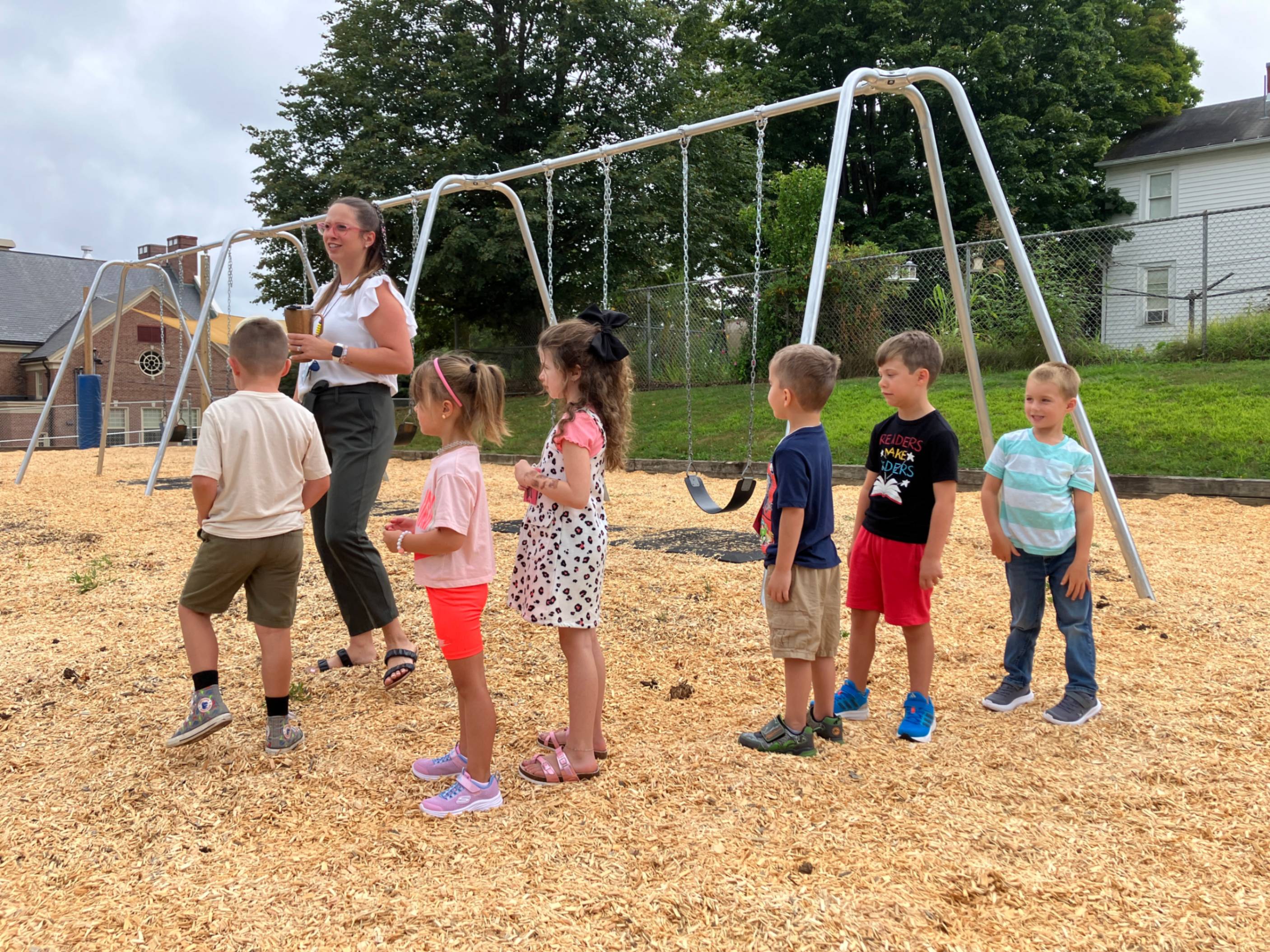 Kindergarteners visit the playground with Mrs. Yard.